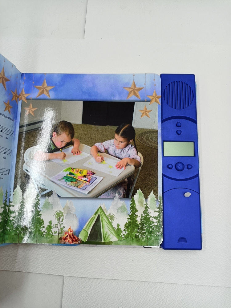 Interior illustrated page from Little Melodies Song Book
